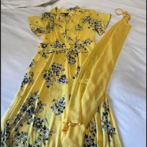 Beautiful deep yellow and blue dress. Slip goes under. About a midi length.